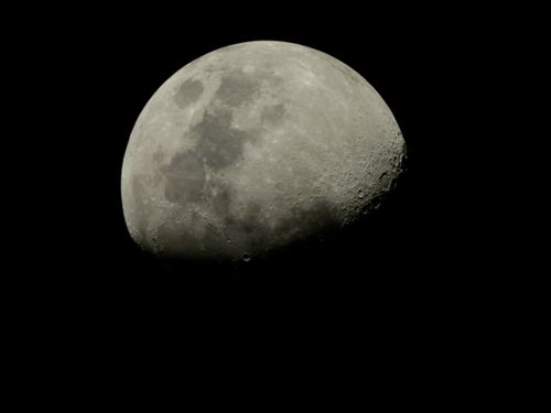 Free A detailed nighttime photograph capturing the surface of Earth's moon from Pittsburgh, PA. Stock Photo