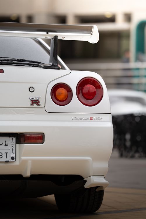 Free Rear view of a classic sports car in Dhahran, showcasing its sleek design and iconic taillights. Stock Photo