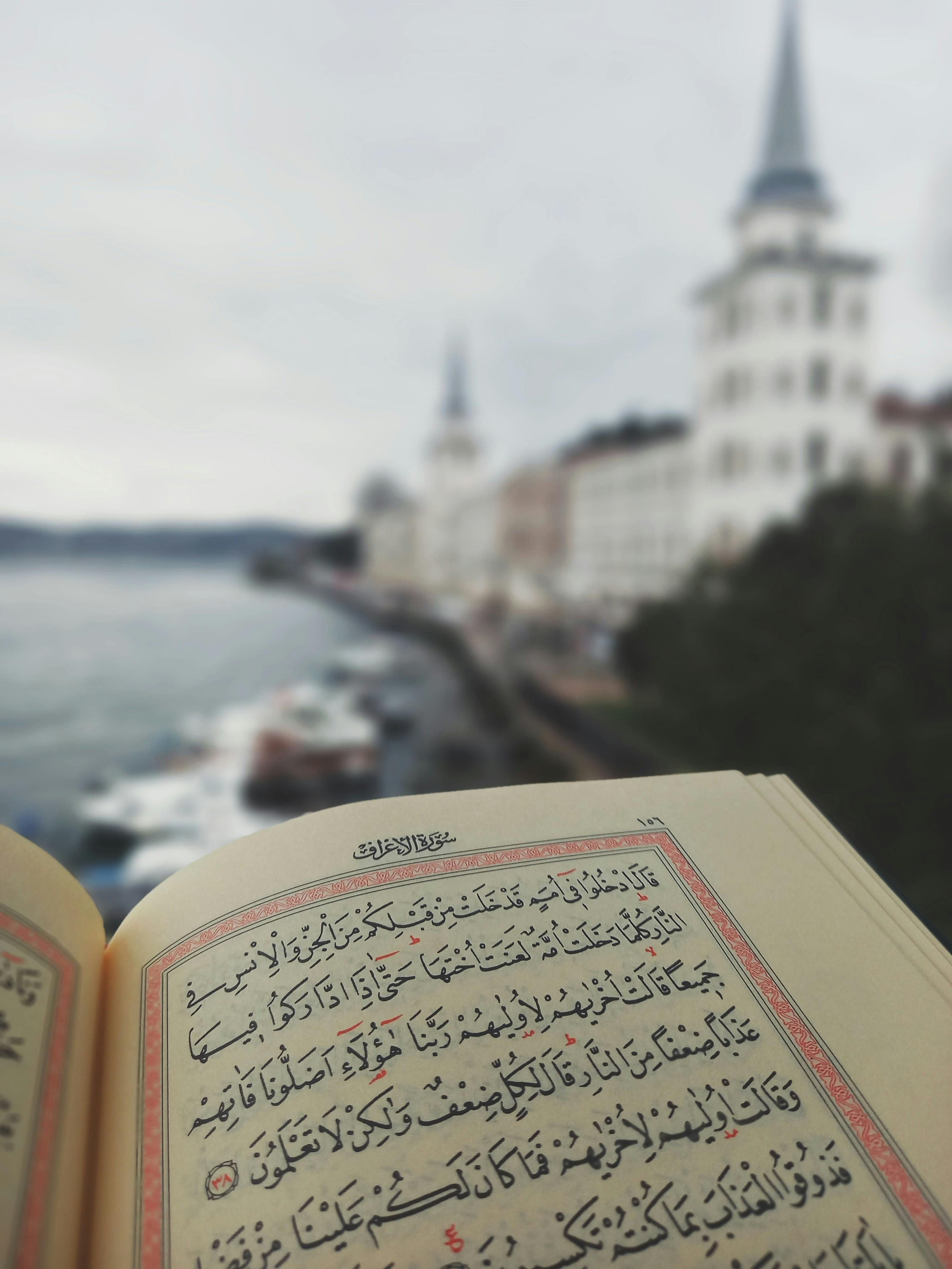 An open Quran with a scenic view of Istanbul's iconic skyline in the background.