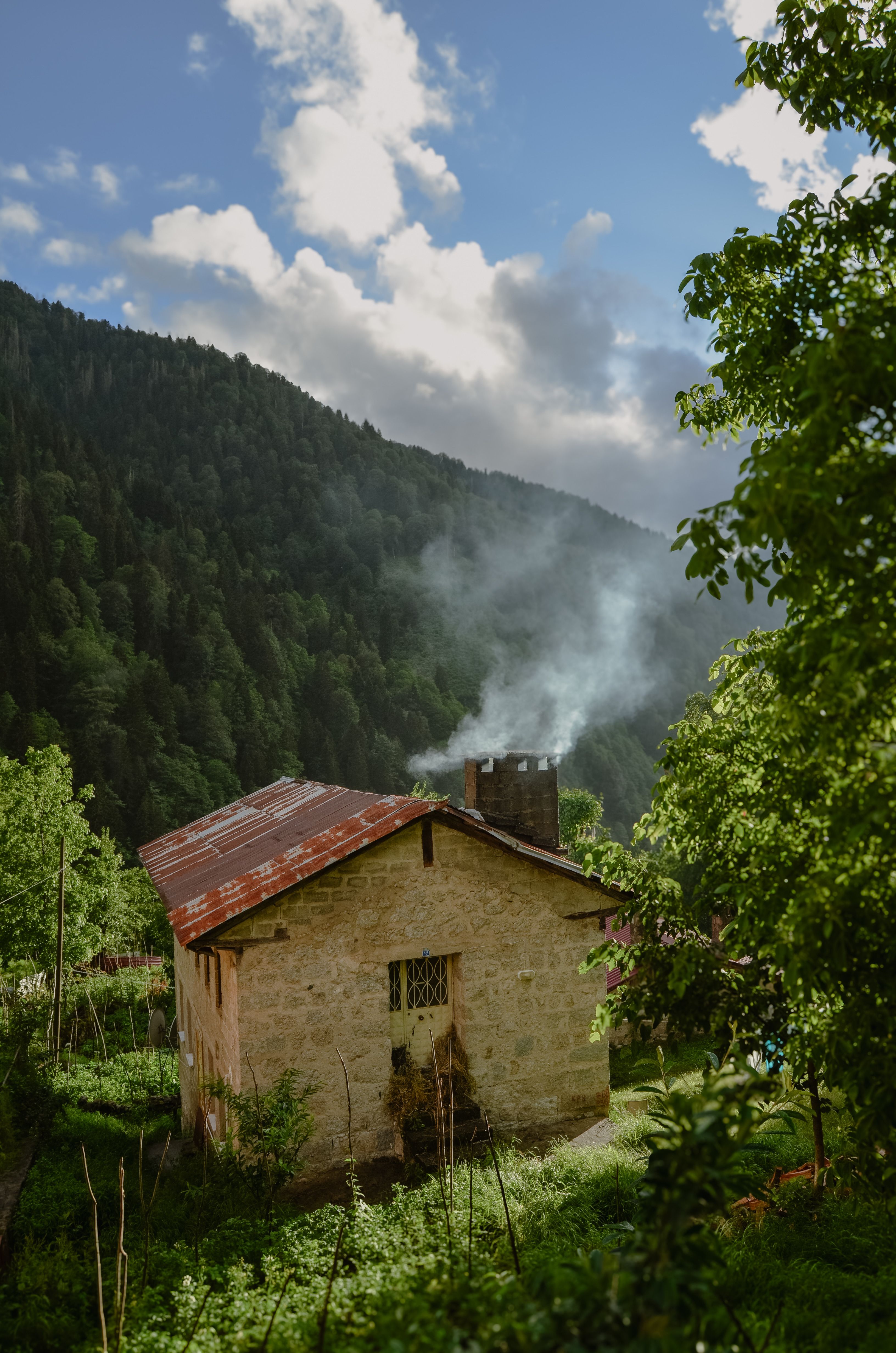 Cozy Cottage in Misty Mountain Landscape · Free Stock Photo