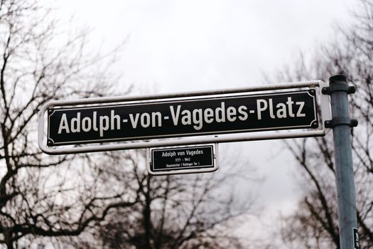 Street sign showcasing Adolph von Vagedes Platz, a historic location in Düsseldorf, Germany.