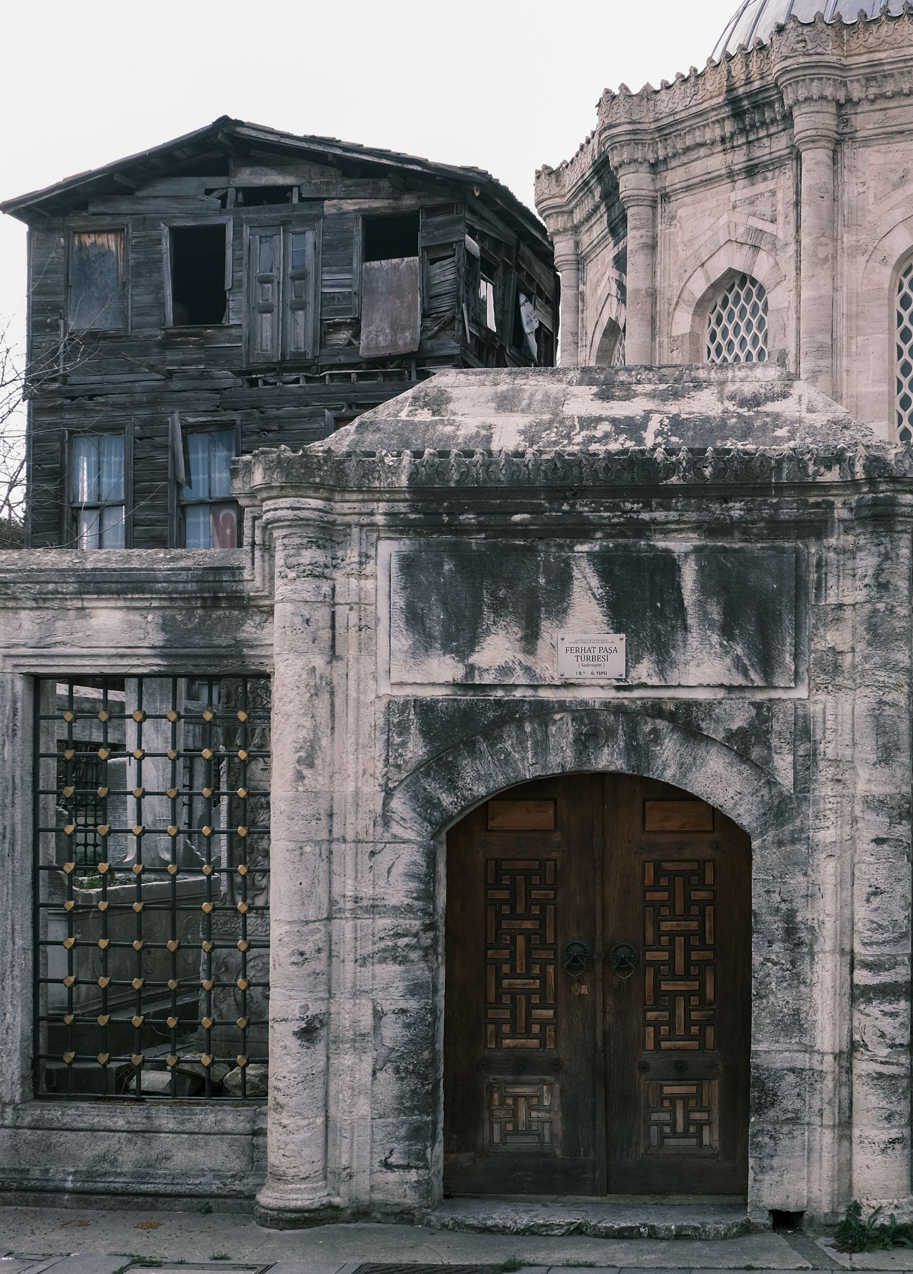 Historic Stone Building with Ornate Wooden Door · Free Stock Photo