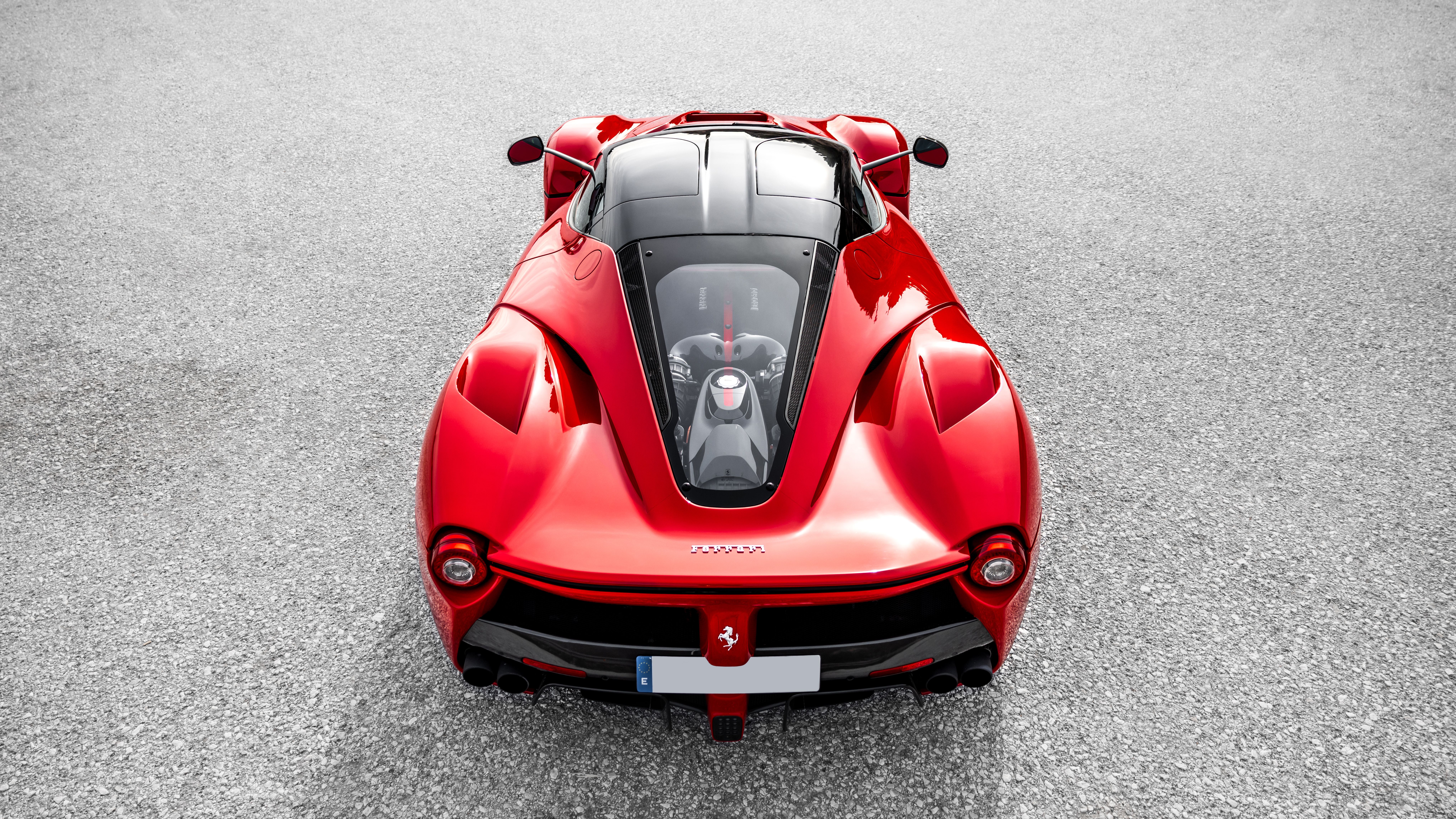 Supercar displayed in a minimalist luxury showroom