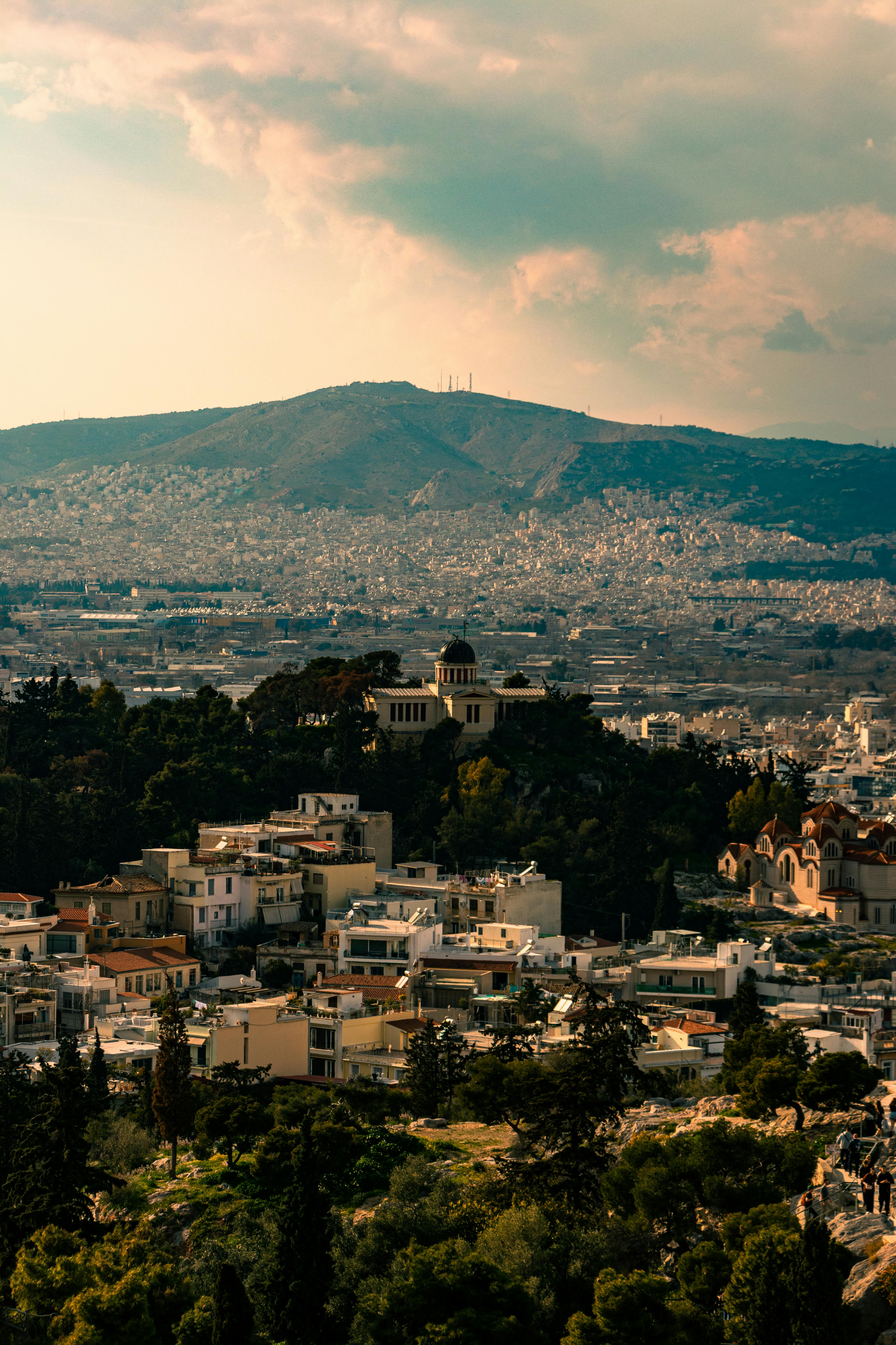 Aerial View of Athens Cityscape against Mountain Backdrop · Free Stock Photo, image size:4000x6000