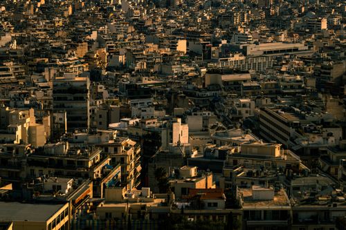 Free Aerial view of Athens cityscape at twilight showcasing dense urban architecture. Stock Photo