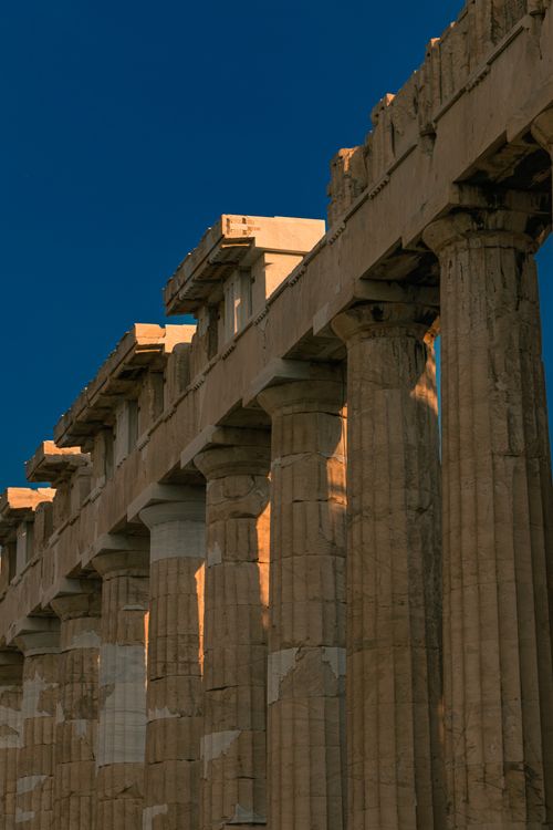 Free Stunning architectural detail of the Parthenon's columns, captured at sunset in Athens, Greece. Stock Photo