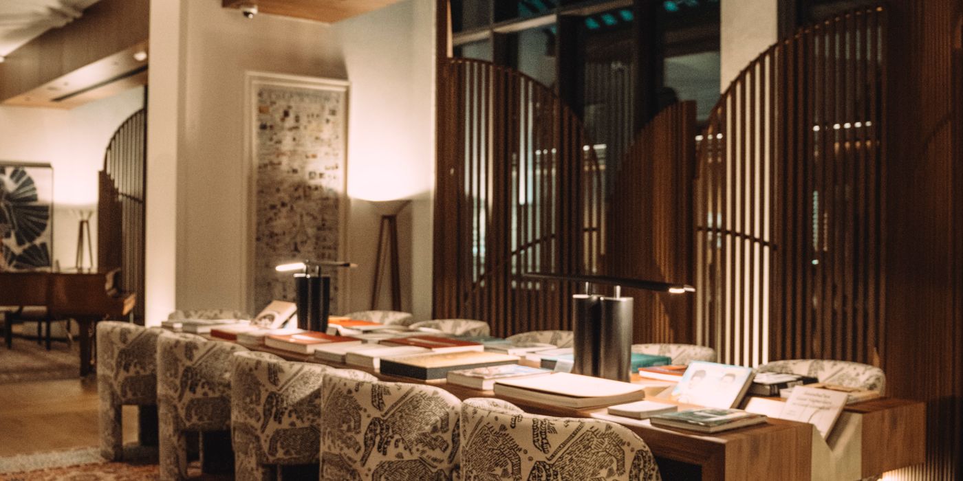 Warmly lit hotel lobby seating area at night