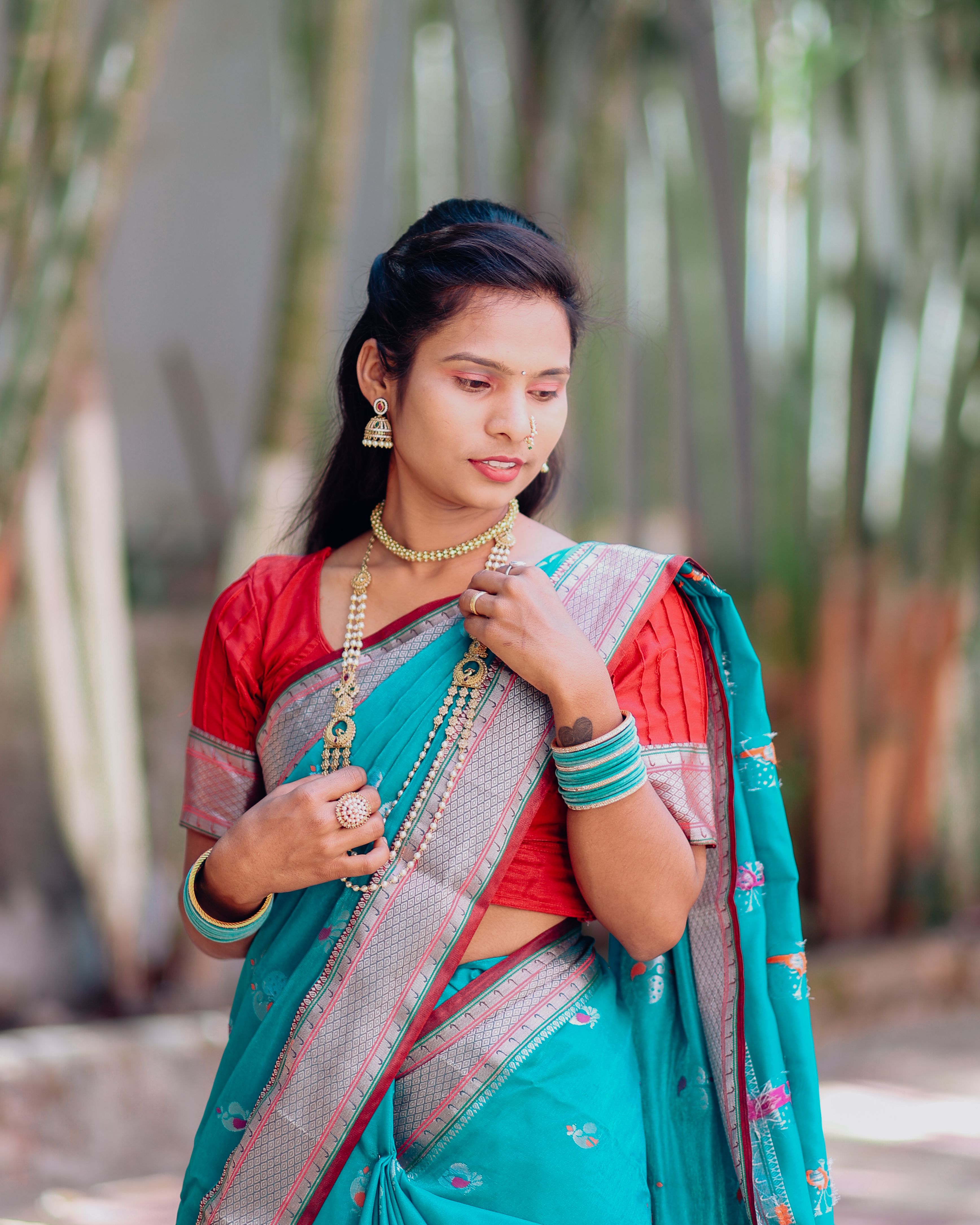 Elegant Woman in Traditional Indian Saree Outdoors · Free Stock Photo