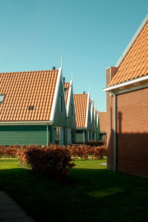 Free Traditional Dutch houses with orange roofs in Volendam, Noord-Holland, Netherlands. Stock Photo