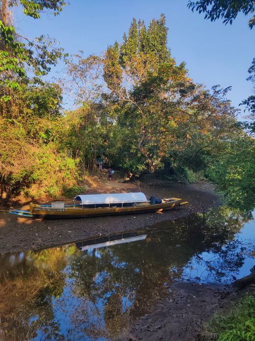 Free Serene fishing boat on a peaceful river in Mayabunder, Andaman Islands, India. Stock Photo