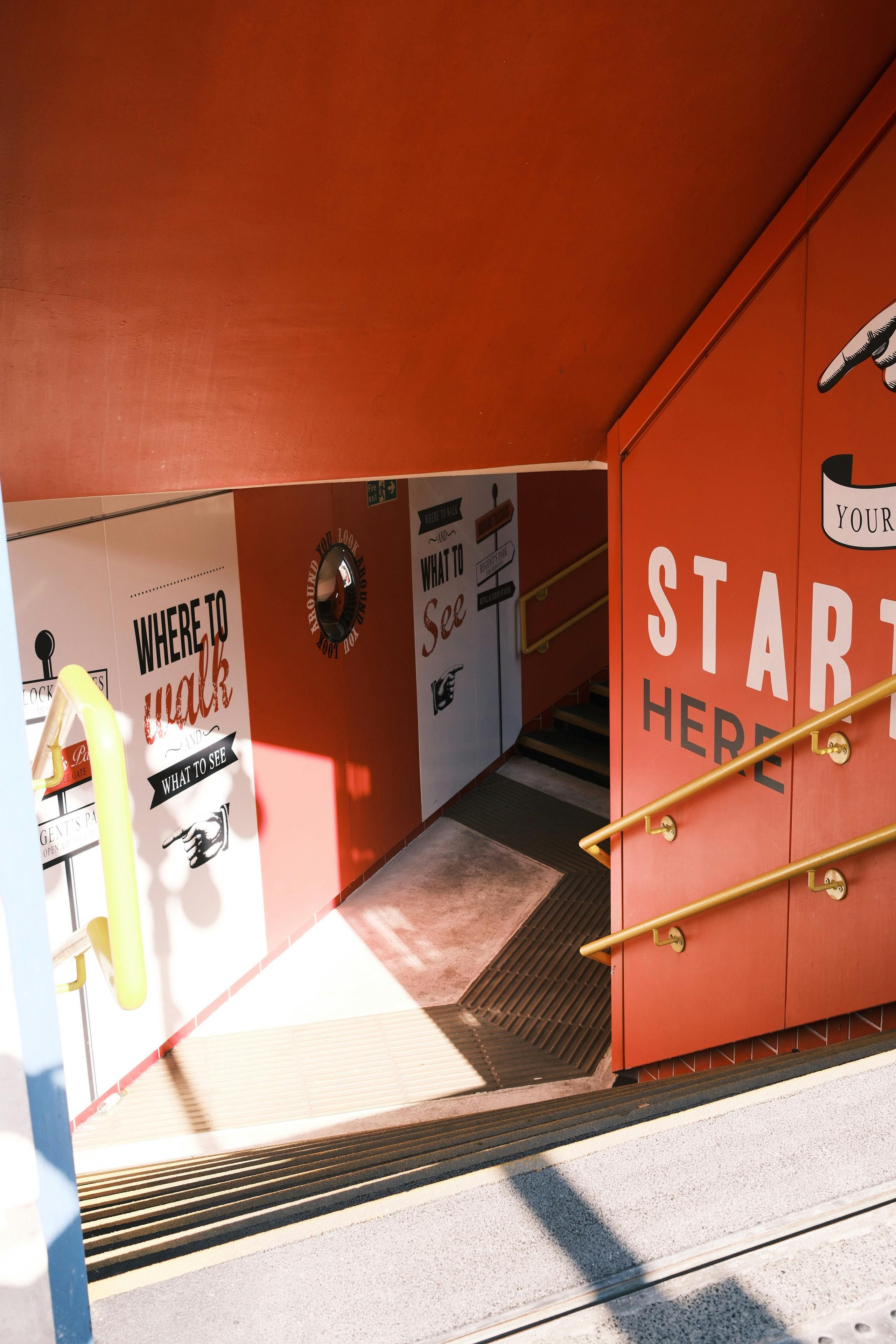 Brightly colored staircase with motivational signage, perfect for creativity.