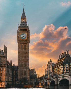 Stunning view of Big Ben and Westminster Bridge at sunset in London, England.