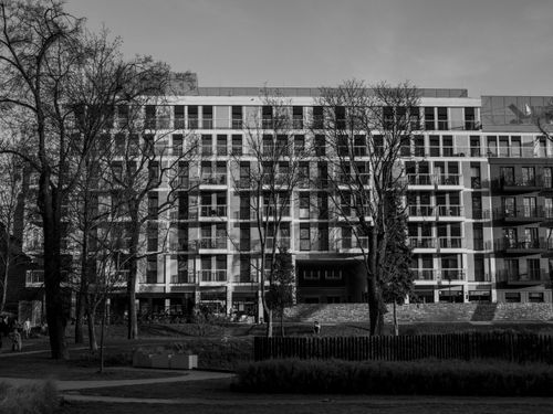 Free Monochrome view of a contemporary apartment building in a city park. Stock Photo