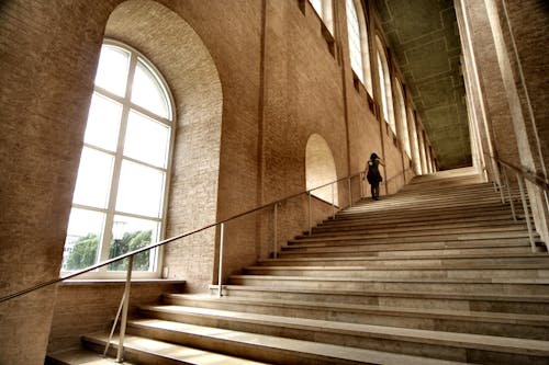 Free Person Walking Up the Stairs Stock Photo