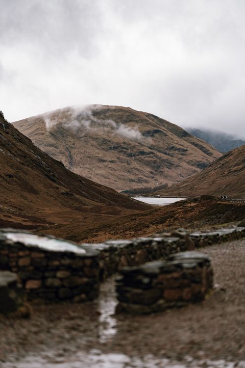 Free Dramatic misty mountains in Fort William, Scotland. A scenic highland view. Stock Photo