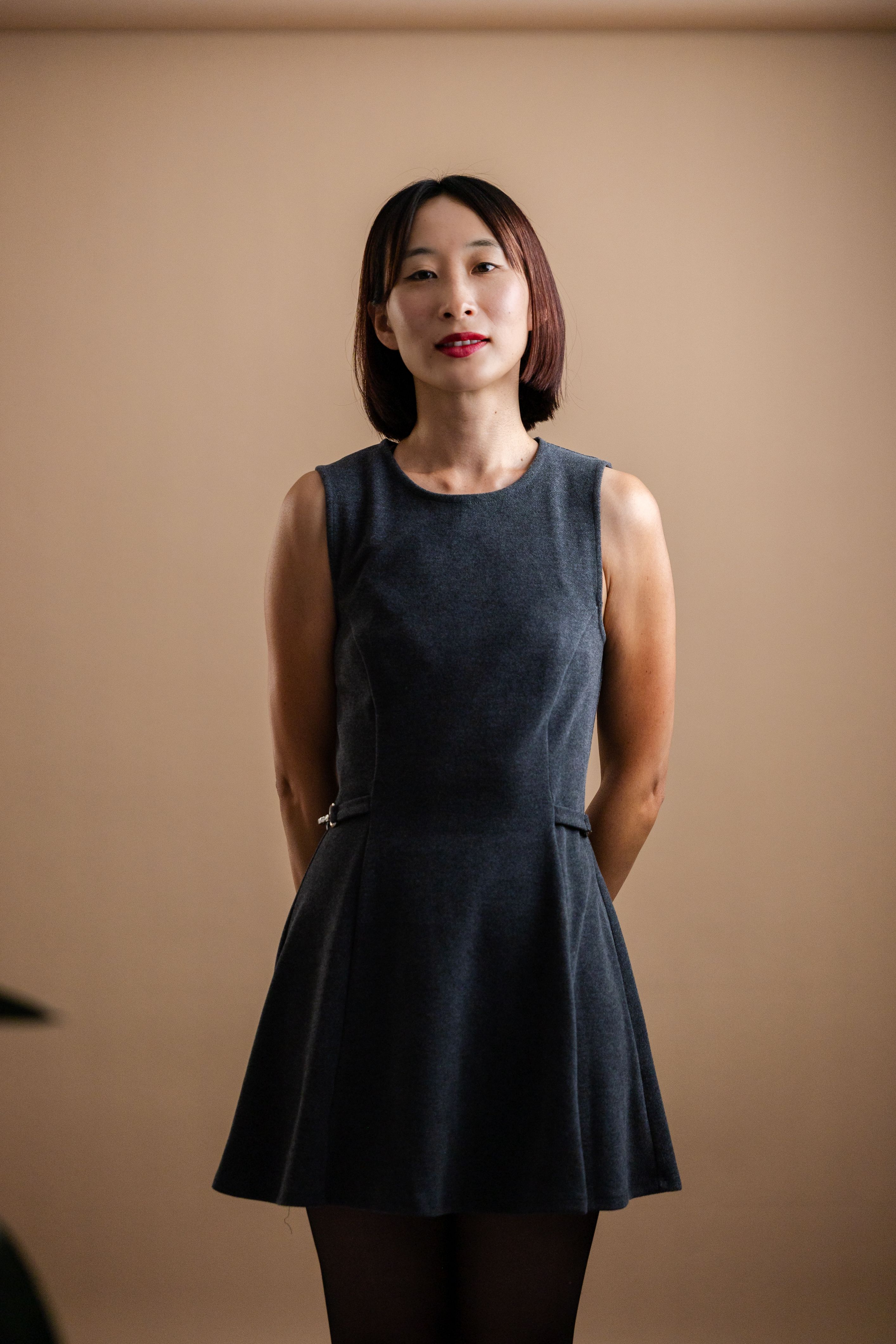 Portrait of a Woman in Elegant Dark Dress · Free Stock Photo