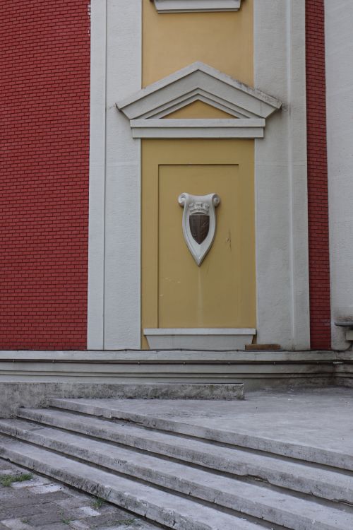 Free Close-up of an ornate architectural detail on a classic red brick building facade. Stock Photo