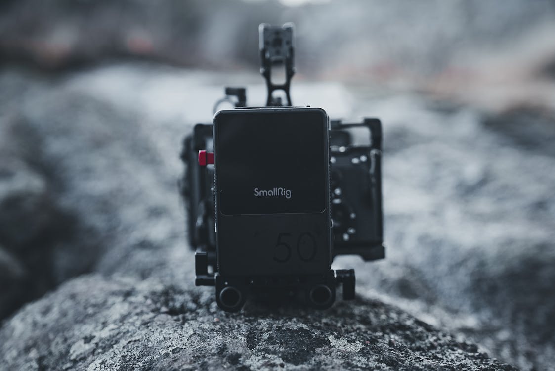 Close-up of SmallRig Camera Setup on Rocky Surface · Free Stock Photo