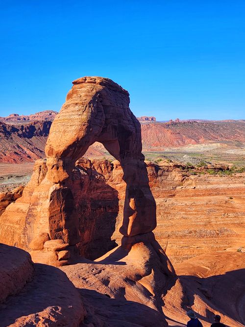 Free Iconic Delicate Arch in Utah's Arches National Park under clear blue skies. Stock Photo