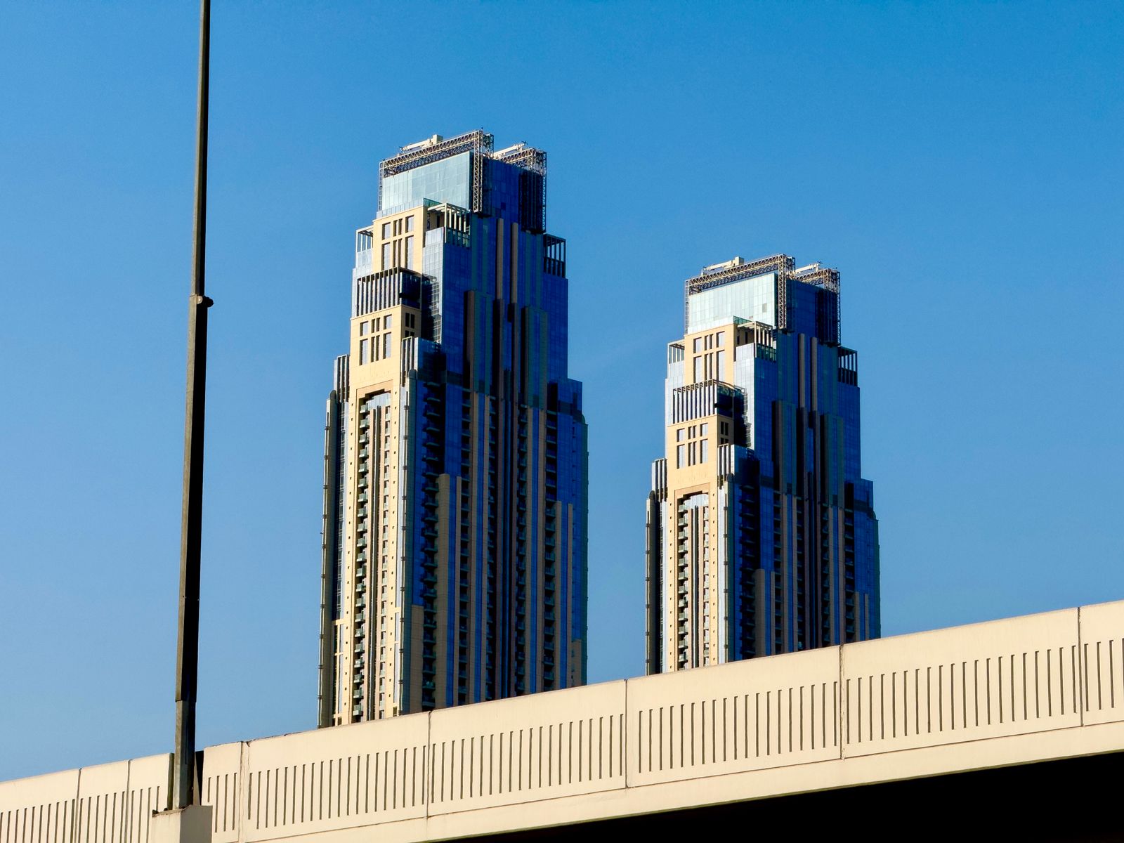 The twin towers of the JW Marriott Marquis rising over Business Bay, the tiered crowns that mark the district's edge on Sheikh Zayed Road.