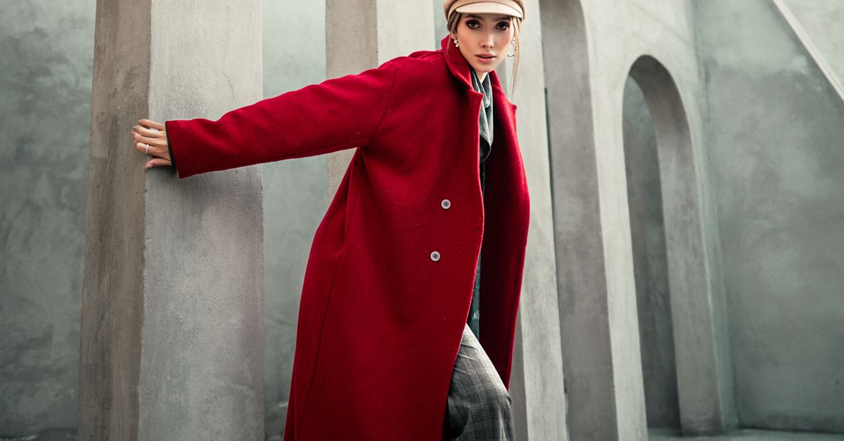 Red wool coat over black dress for holiday party