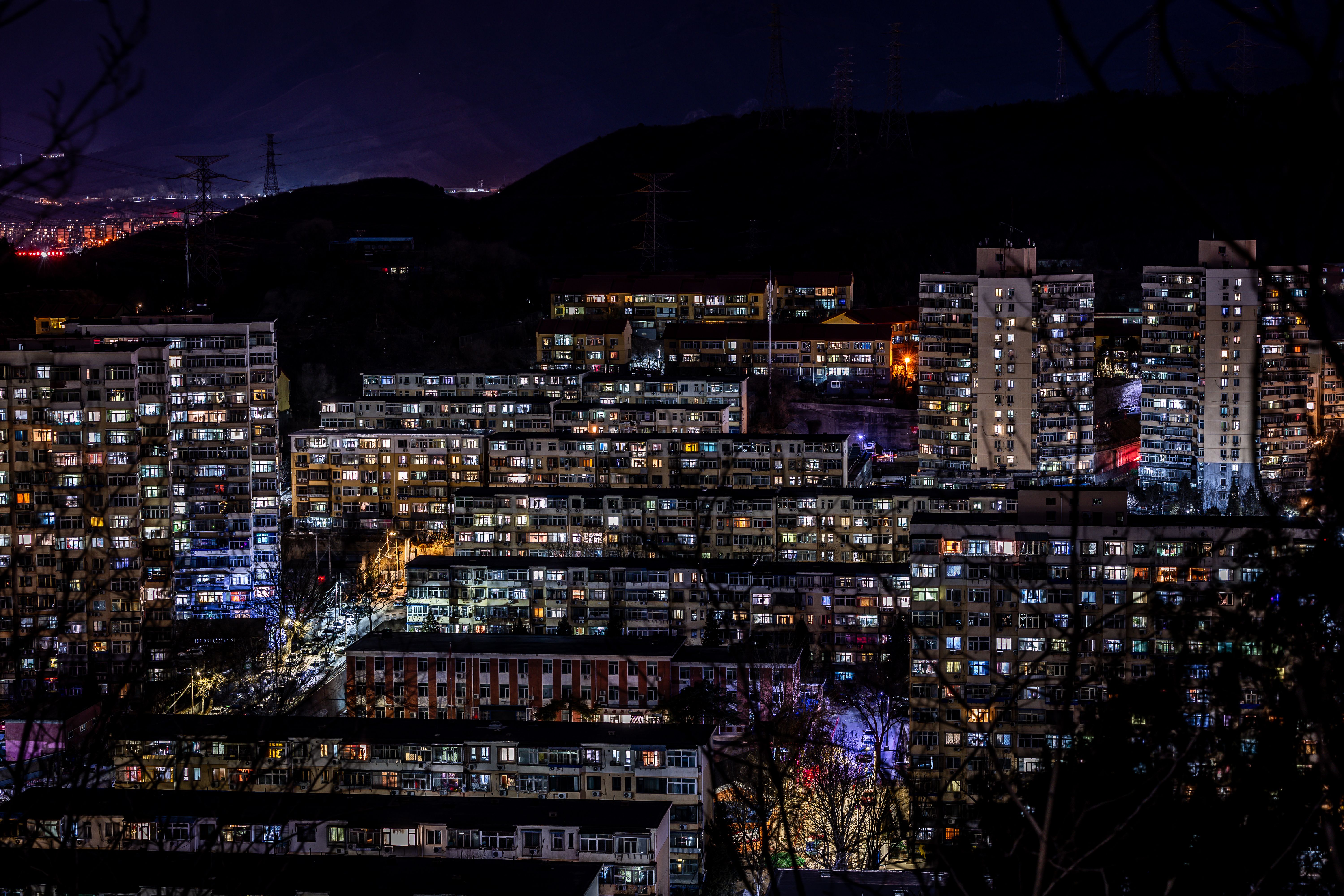 Vibrant Urban Nightscape with Illuminated Buildings · Free Stock Photo