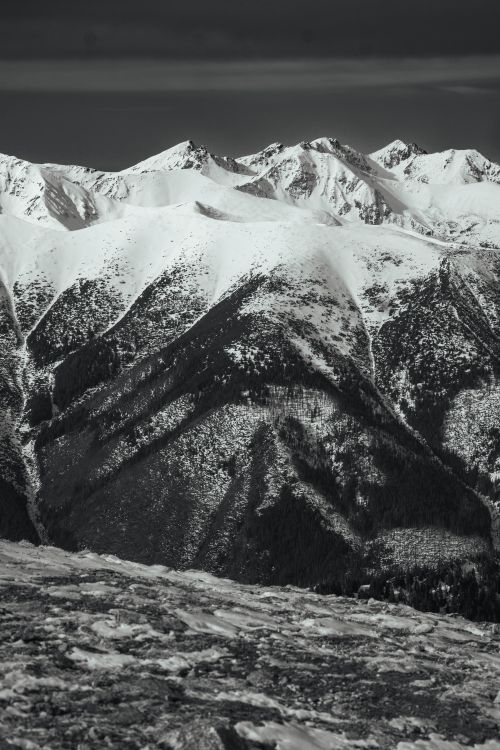 Free Stunning black and white capture of the snowy peaks in the Tatra Mountains, showcasing winter's beauty. Stock Photo