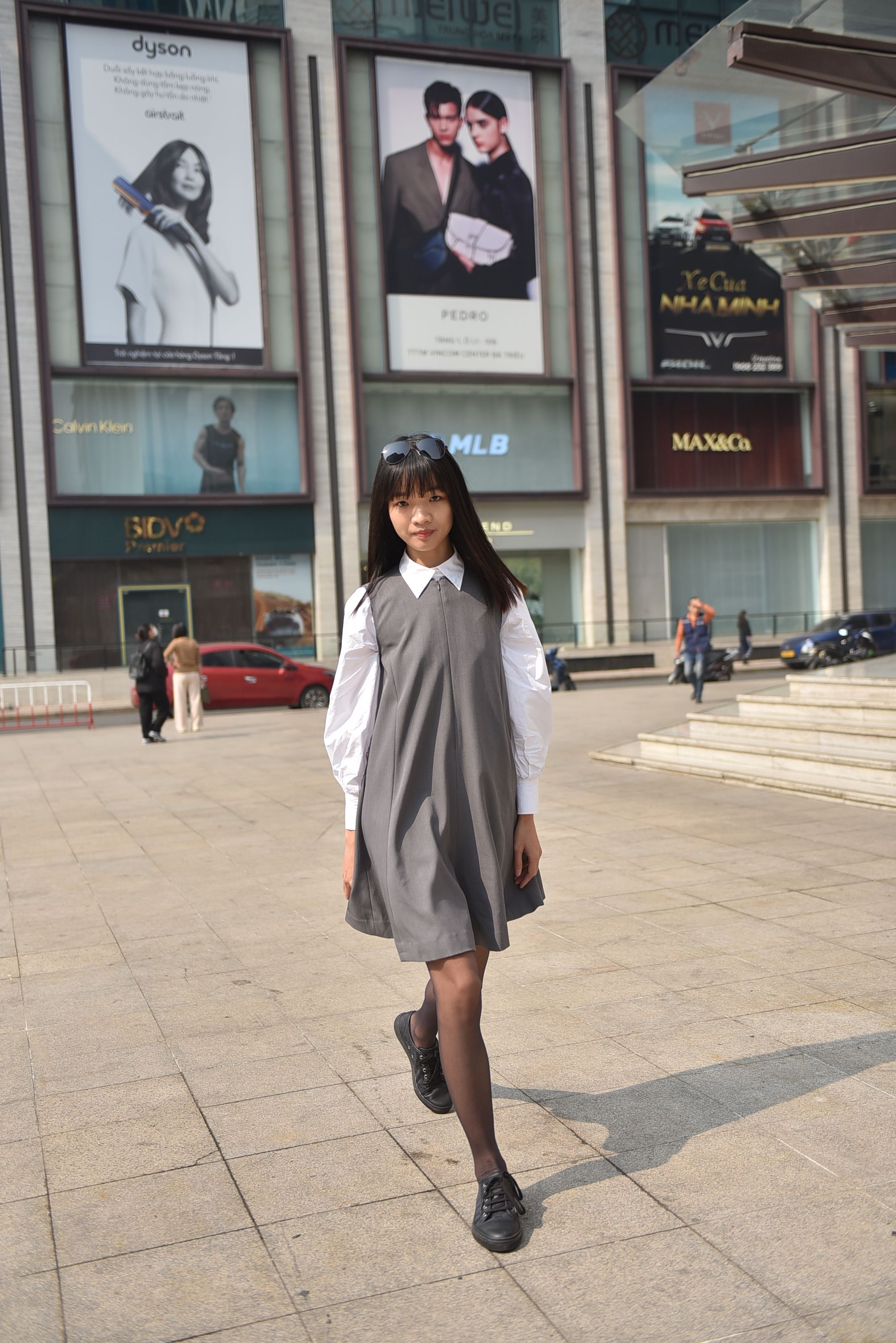 Young Woman Walking in Urban Fashion Setting · Free Stock Photo