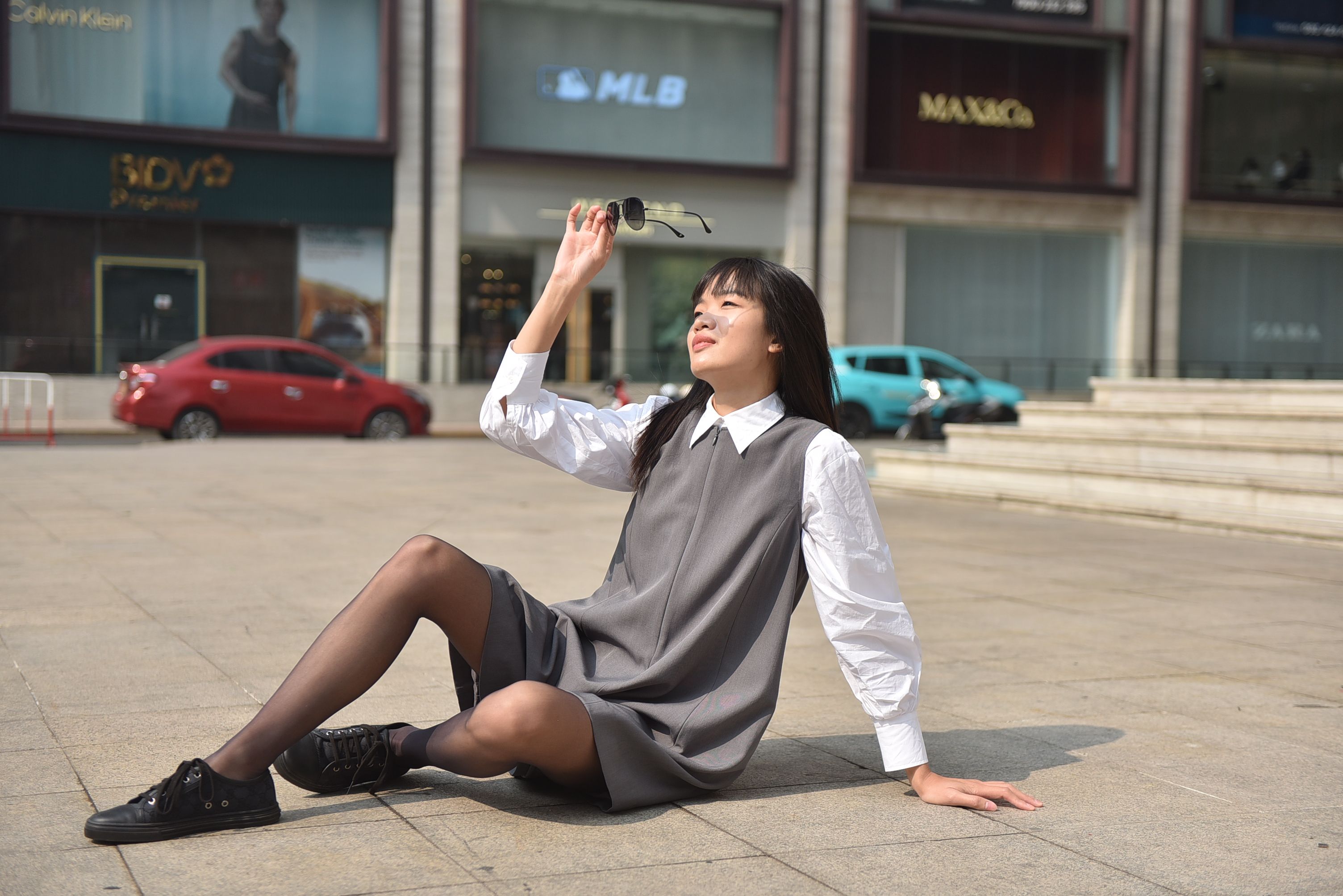 Stylish Woman Posing Outdoors in Urban Setting · Free Stock Photo