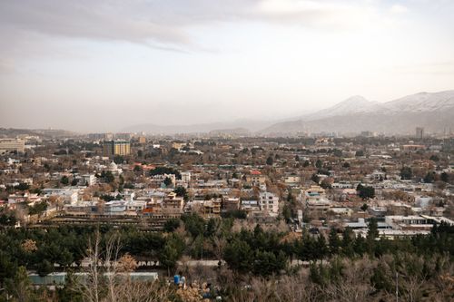 Free A sweeping aerial view of Kabul, Afghanistan showcasing urban landscape against mountainous backdrop. Stock Photo