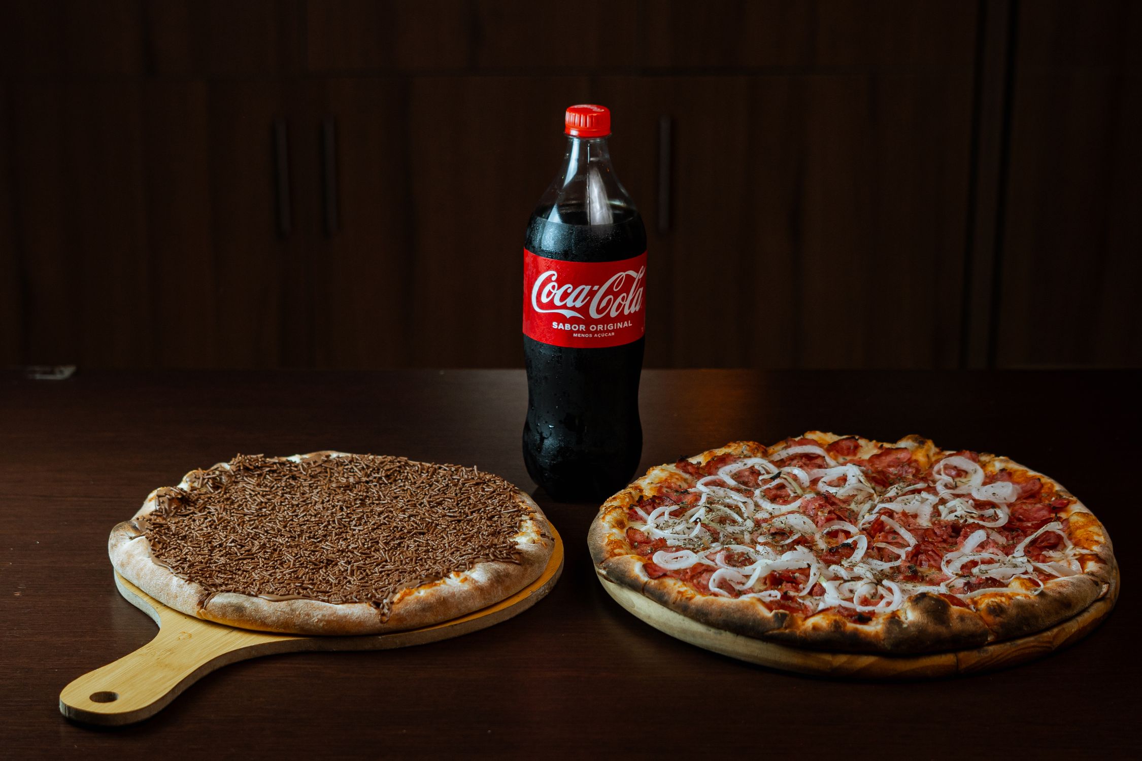 Pizzas with Coca Cola on Wooden Table · Free Stock Photo