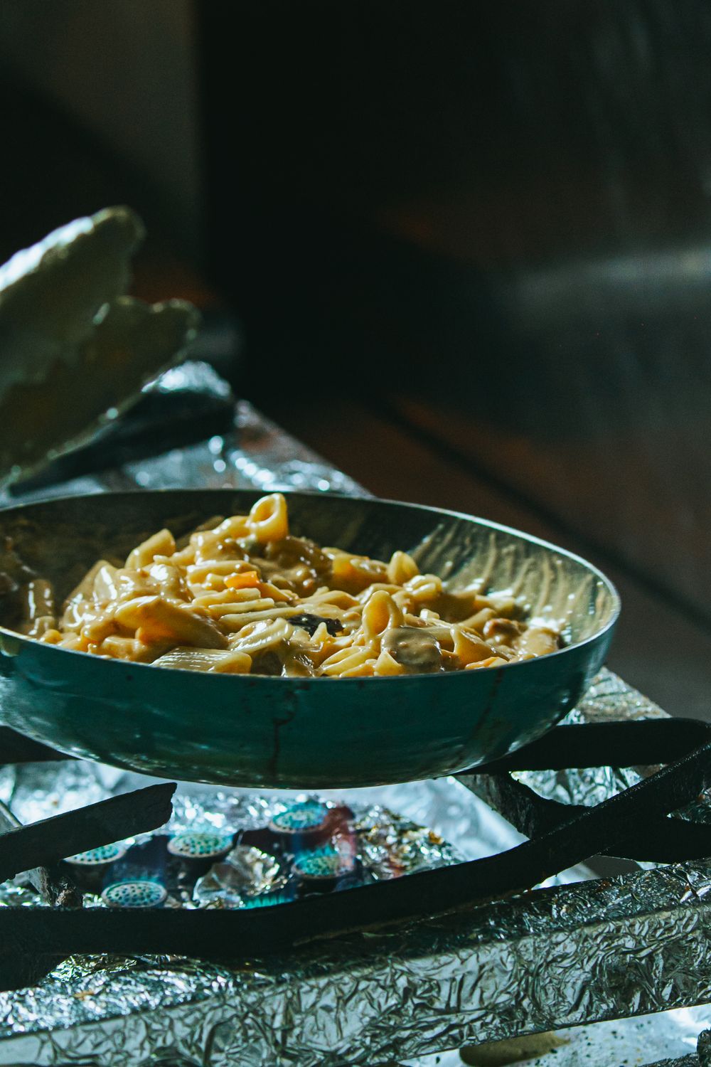 Rustic Pasta Dish Cooking on Stove · Free Stock Photo