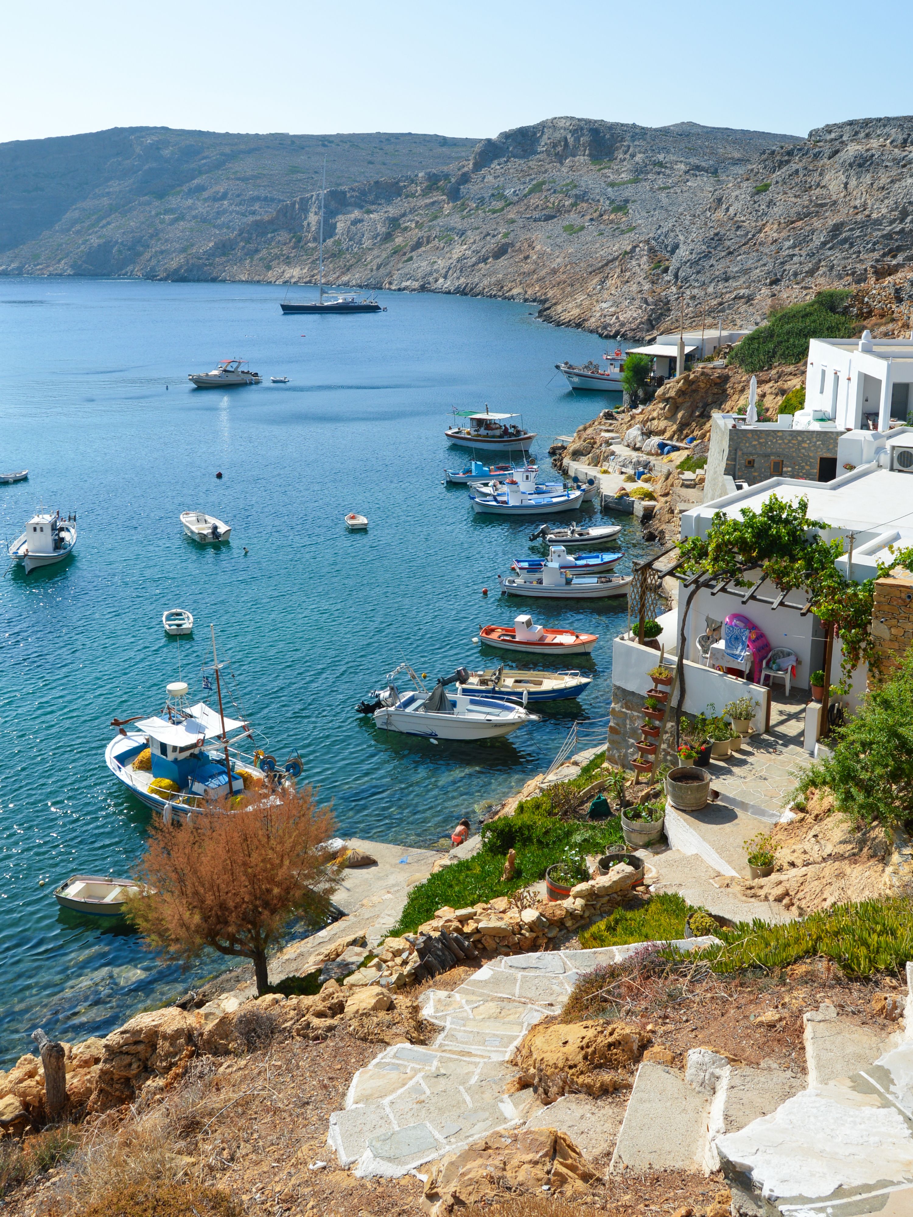 A traditional harbour on Sifnos with fishing boats and whitewashed Cycladic architecture