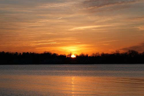 Free Captivating sunrise at Cove Island Park, Stamford, Connecticut, reflected on calm waters. Stock Photo