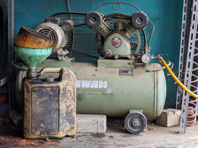 Old industrial air compressor in a workshop
