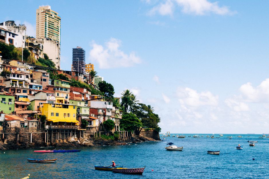 Vibrant coastal cityscape of Salvador, featuring colorful buildings by the ocean.