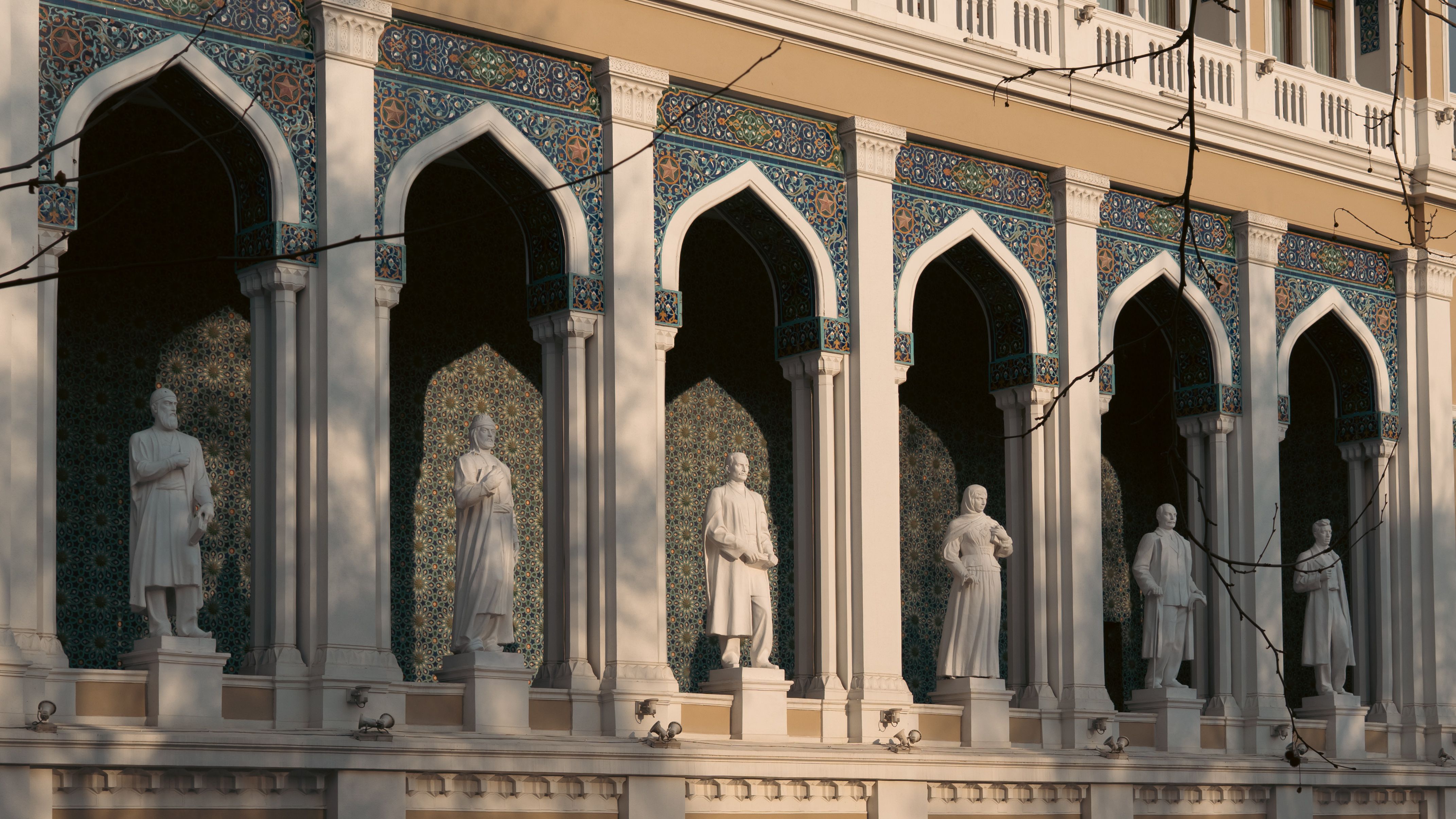 Ornate Architectural Facade with Classical Statues · Free Stock Photo