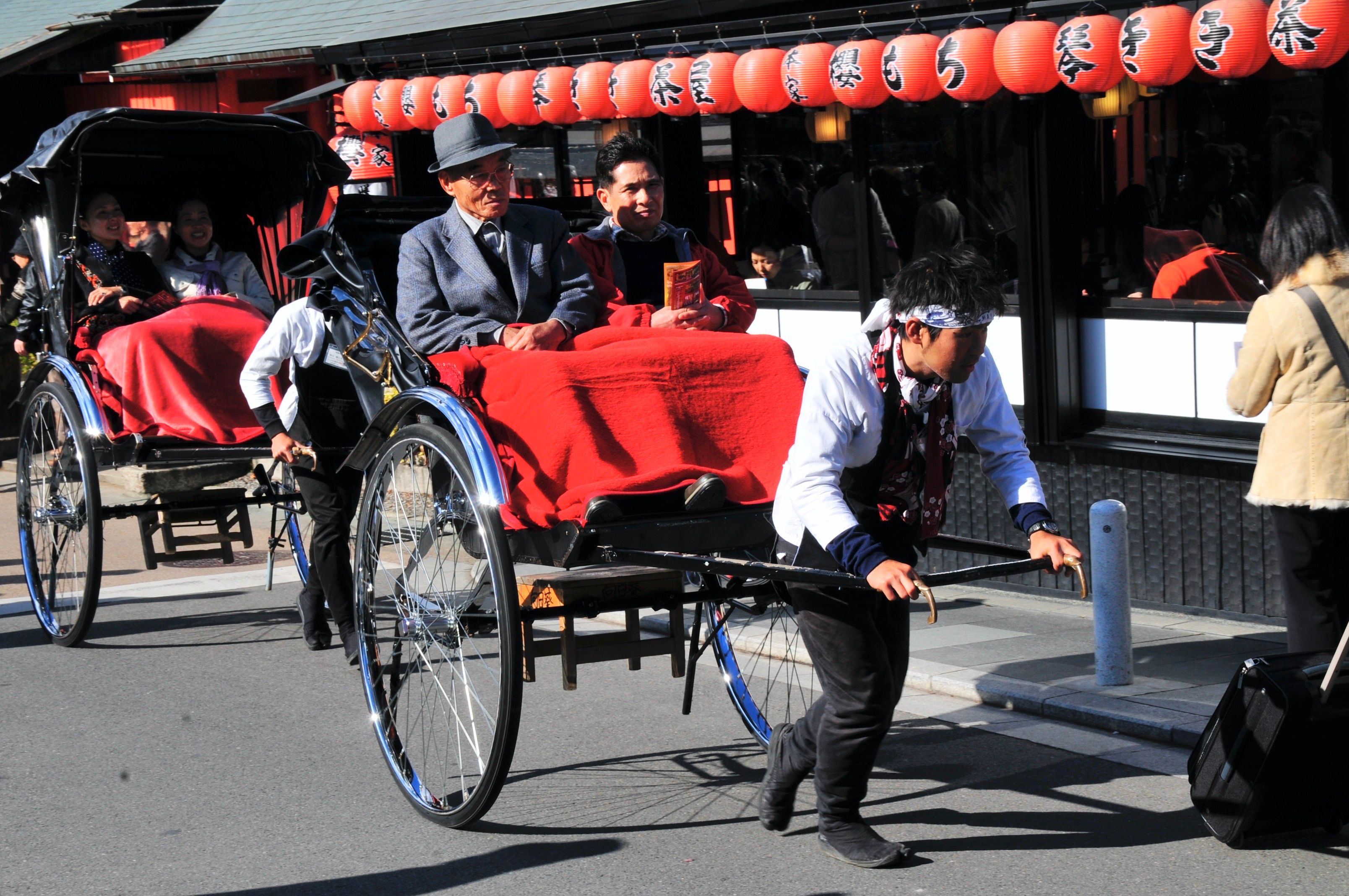 Traditional Rickshaw Ride in Japanese Street · Free Stock Photo