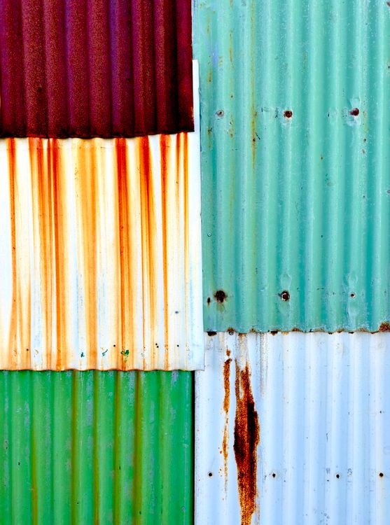 Vibrant Corrugated Metal Panels with Rust Patterns · Free Stock Photo