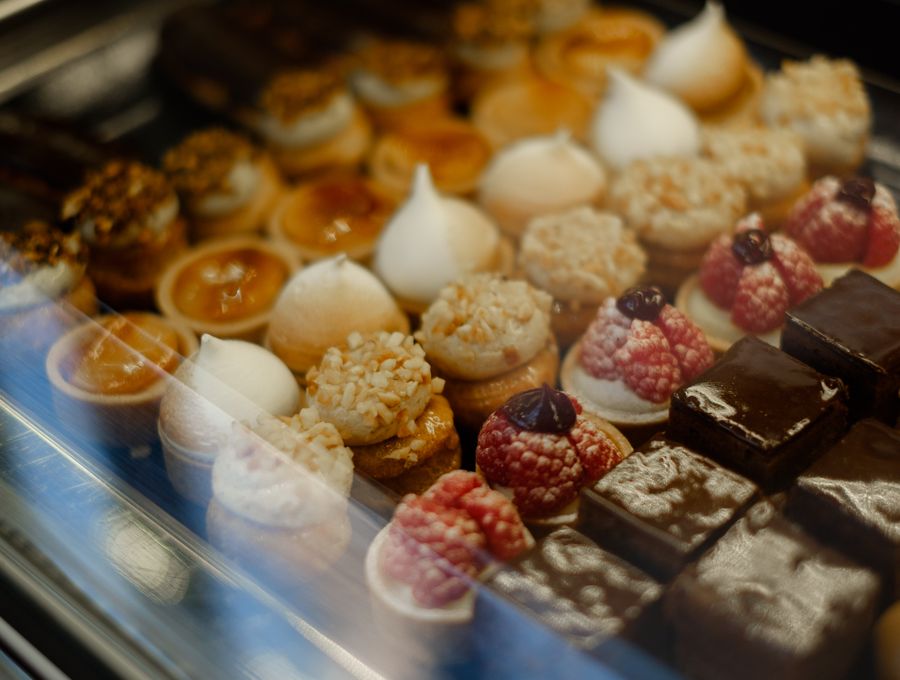 Assortment of pastries and desserts displayed in a bakery
