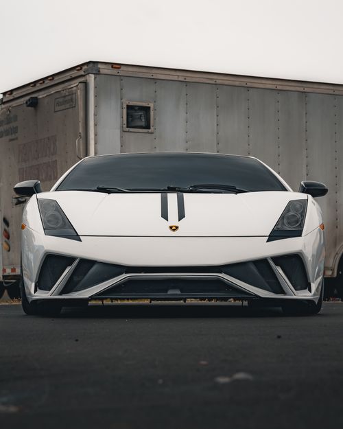 Free Front view of a white Lamborghini Gallardo with a stripe, parked in Tampa. Stock Photo