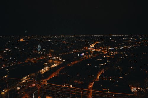 Free Stunning night view of Paris cityscape from Eiffel Tower with illuminated bridges and streets. Stock Photo