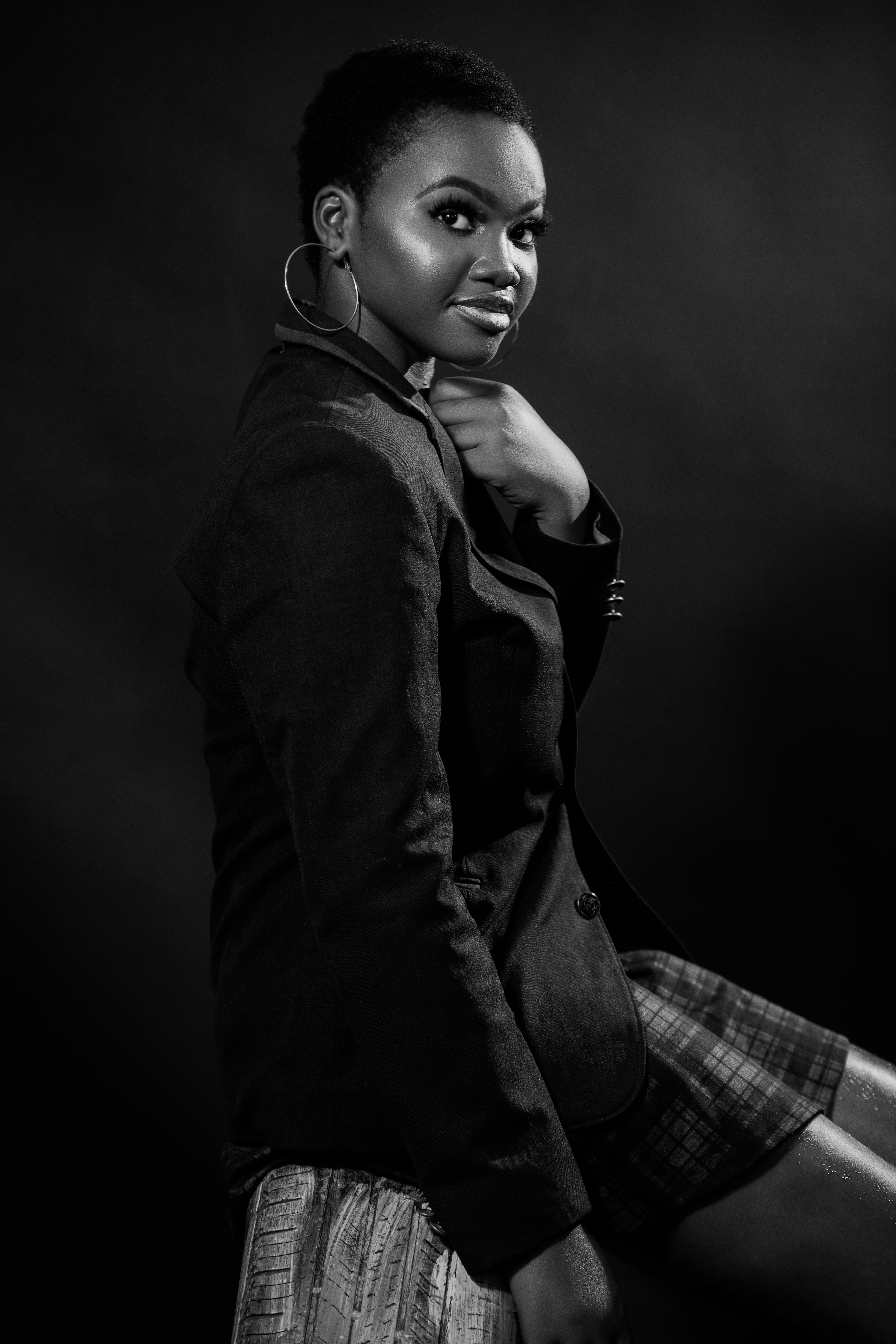 Stunning black and white portrait showcasing the elegance and confidence of an African woman.