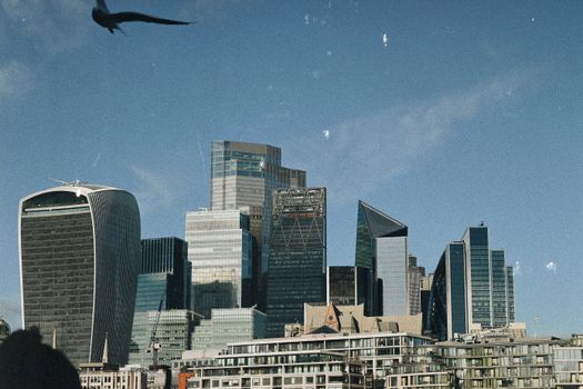 A striking view of London's skyline featuring modern skyscrapers under a clear blue sky.