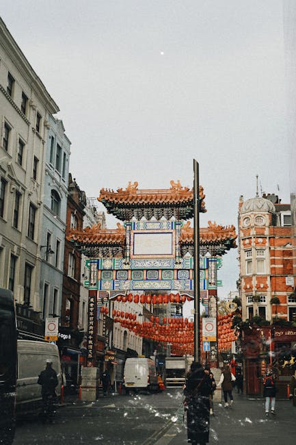 Vibrant photo of London's Chinatown gate surrounded by urban architecture.