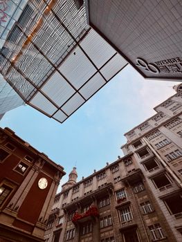 A low-angle view of historic buildings in Tianjin's financial district under a clear sky.