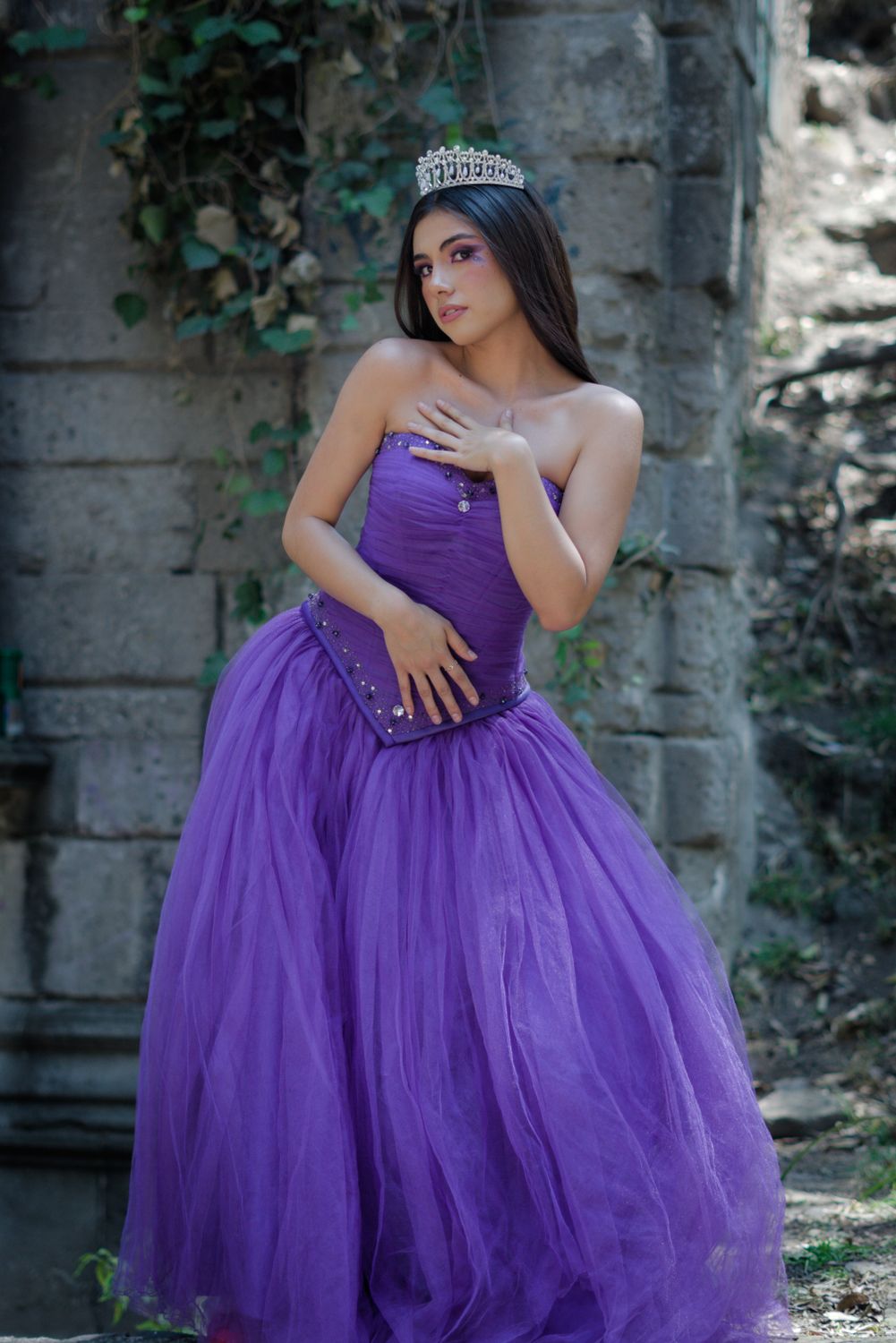 Elegant Woman in Vibrant Purple Gown Outdoors · Free Stock Photo