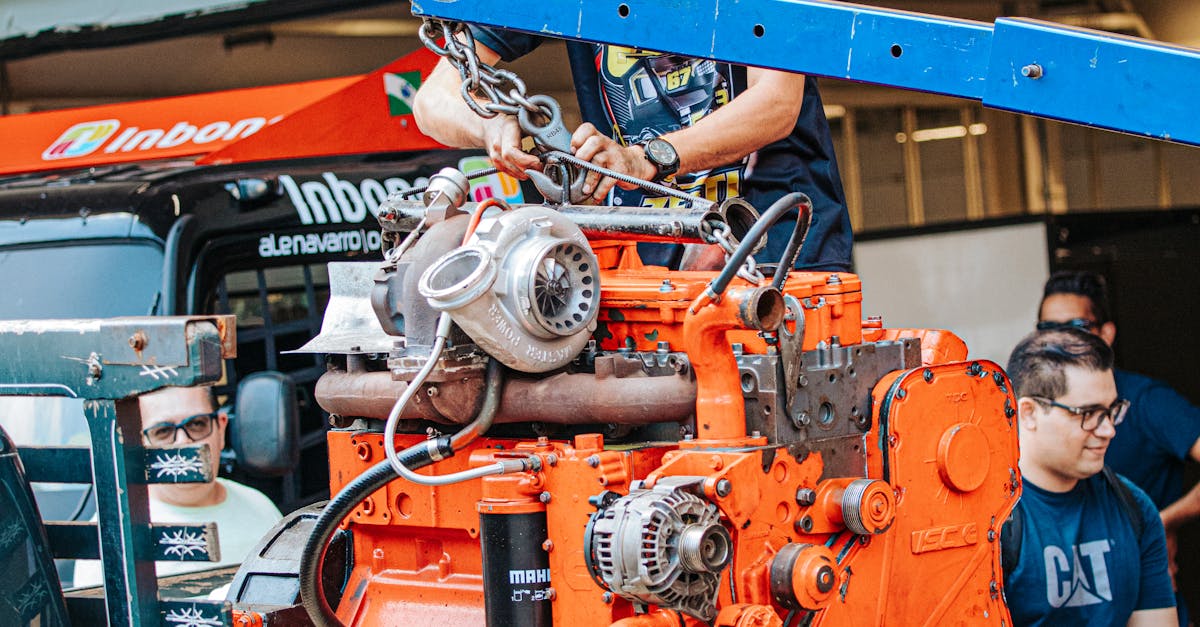 Mechanic Operating Heavy Machinery Engine in São Paulo · Free Stock Photo