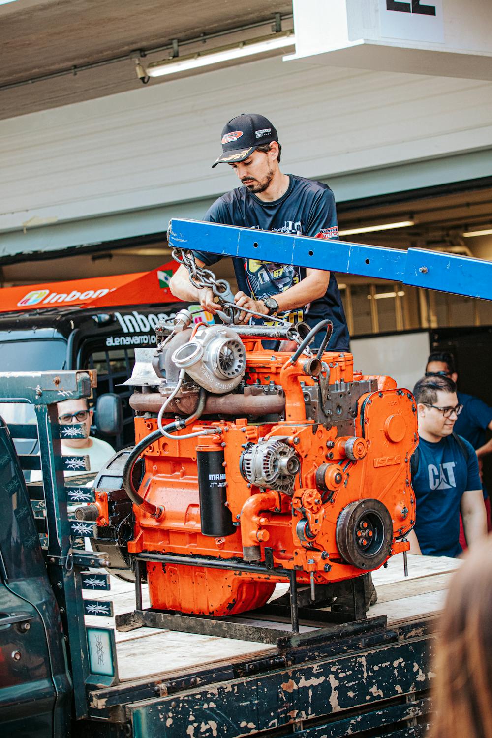 Mechanic Operating Heavy Machinery Engine in São Paulo · Free Stock Photo