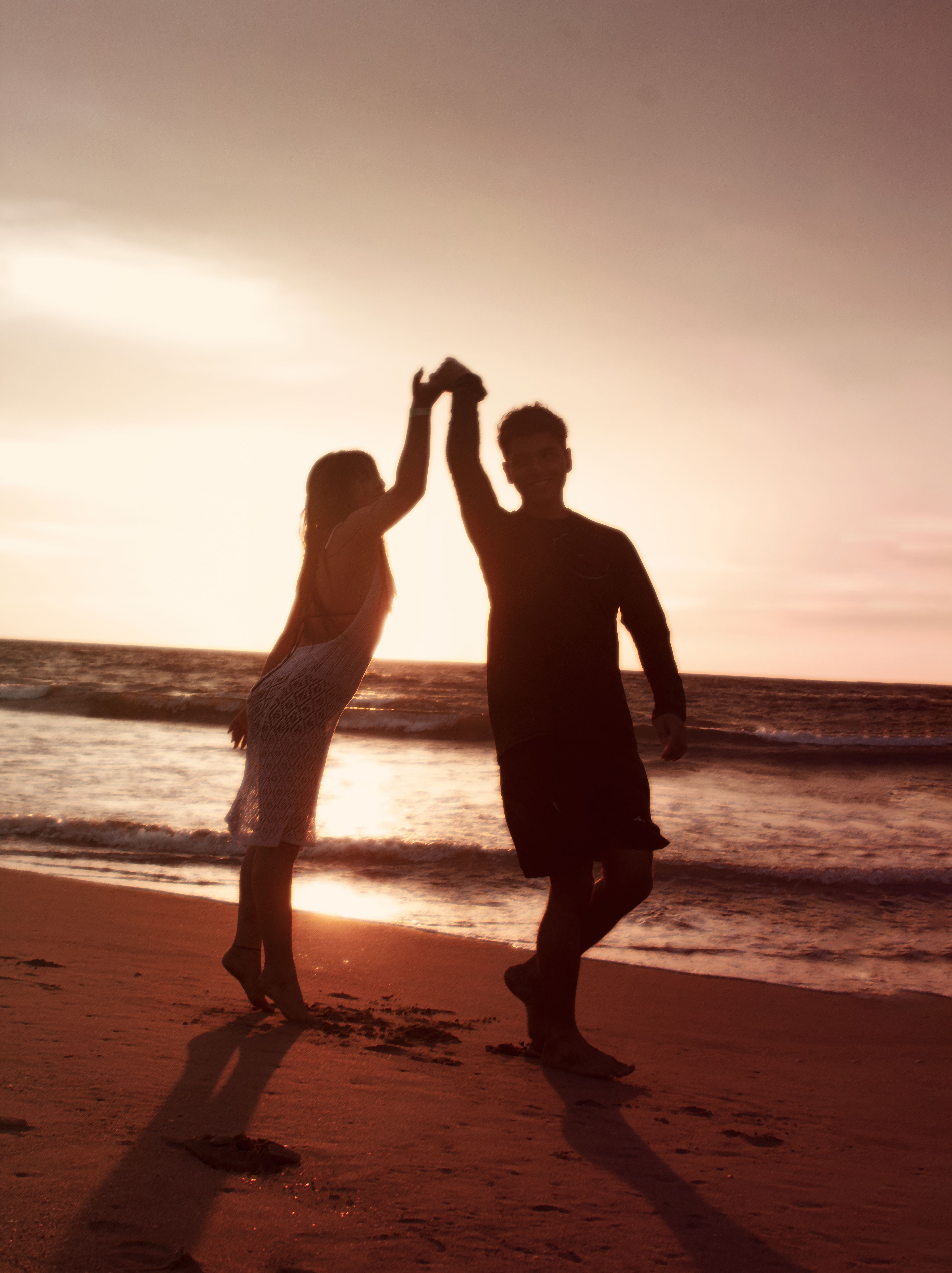 Romantic Silhouette of Couple at Beach Sunset · Free Stock Photo